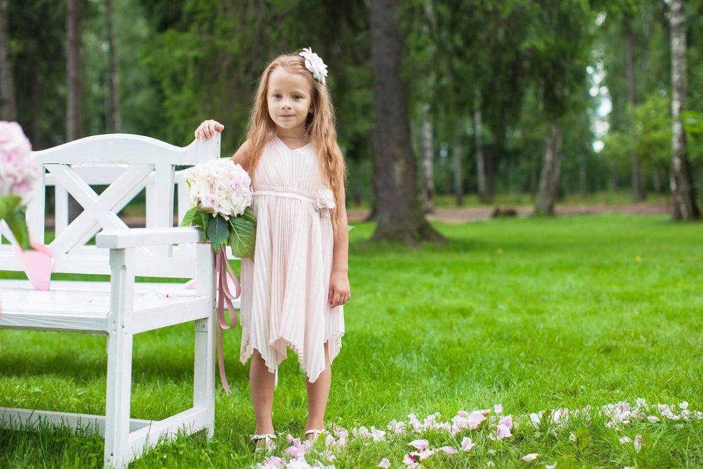A little girl in a dress on her Naming Day